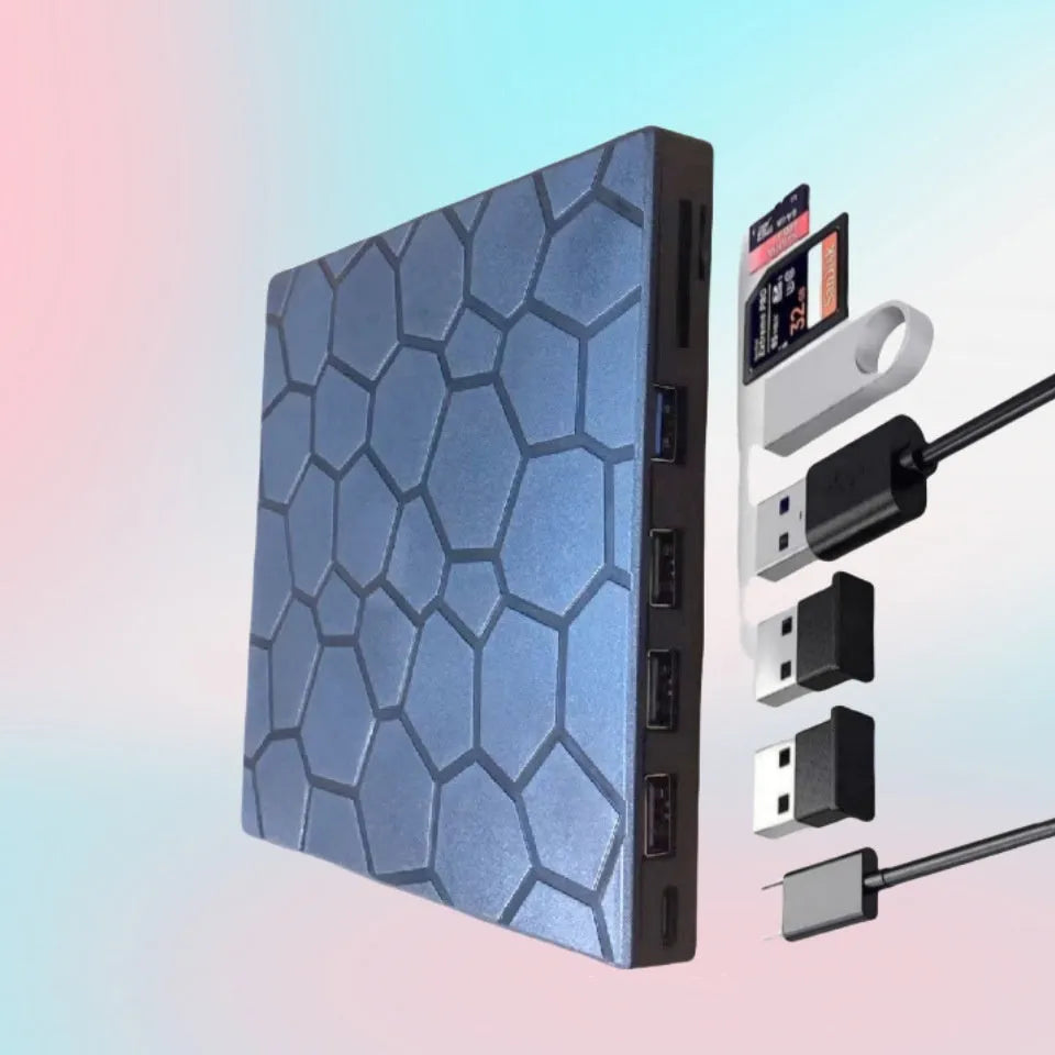 Black external USB CD/DVD burner drive on a desk next to a laptop
