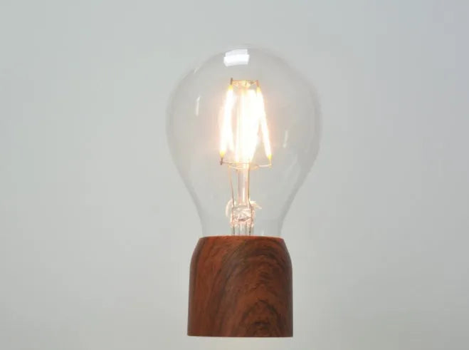 Magnetic levitation floating bulb lamp with imitation wood base and international plug options