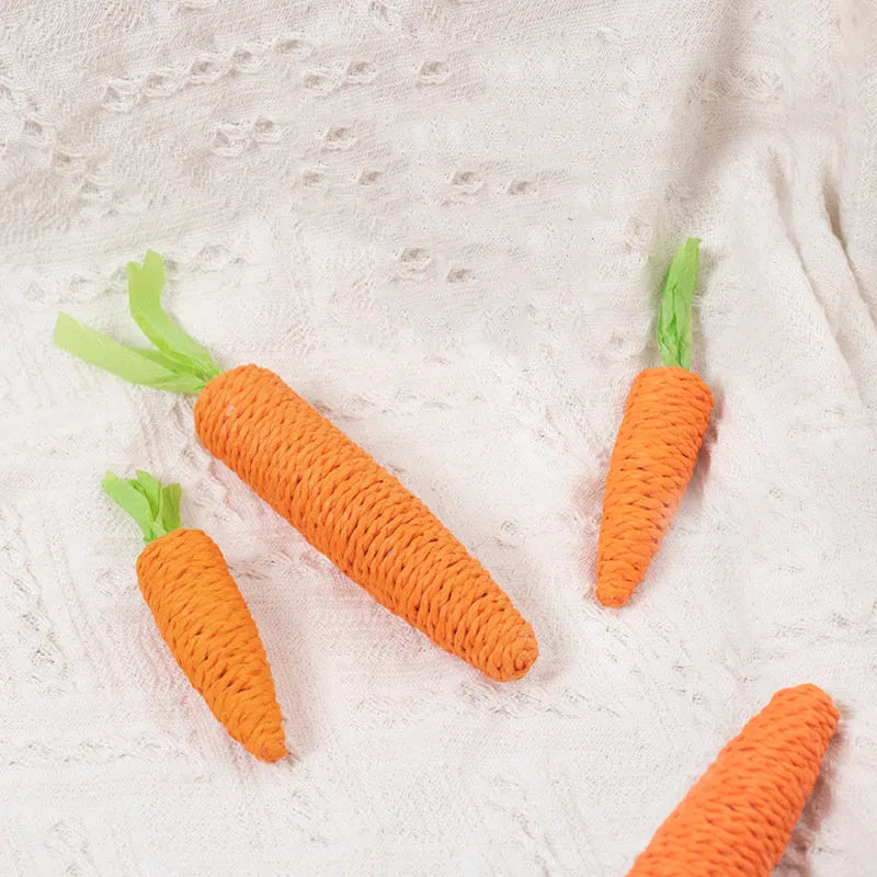 Cat toys bundle with paper crinkle toys, plastic ringing stones, carrot-shaped chews, and grinding sticks