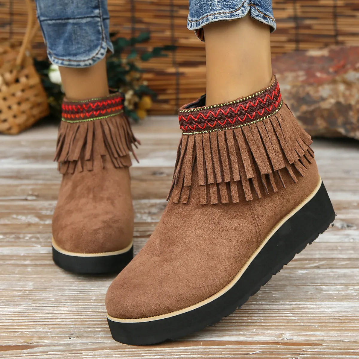 Women's black suede wedge ankle boots with a thick platform sole and side zipper.