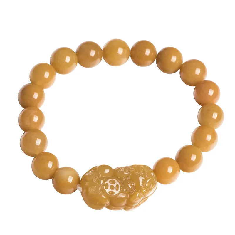 Golden thread Jinsi Jade money bracelet with carved coin charms on beaded strand