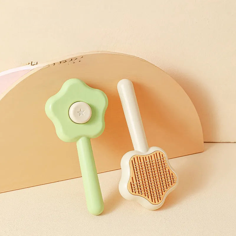 Green pet grooming comb with stainless steel needles and self-cleaning mechanism