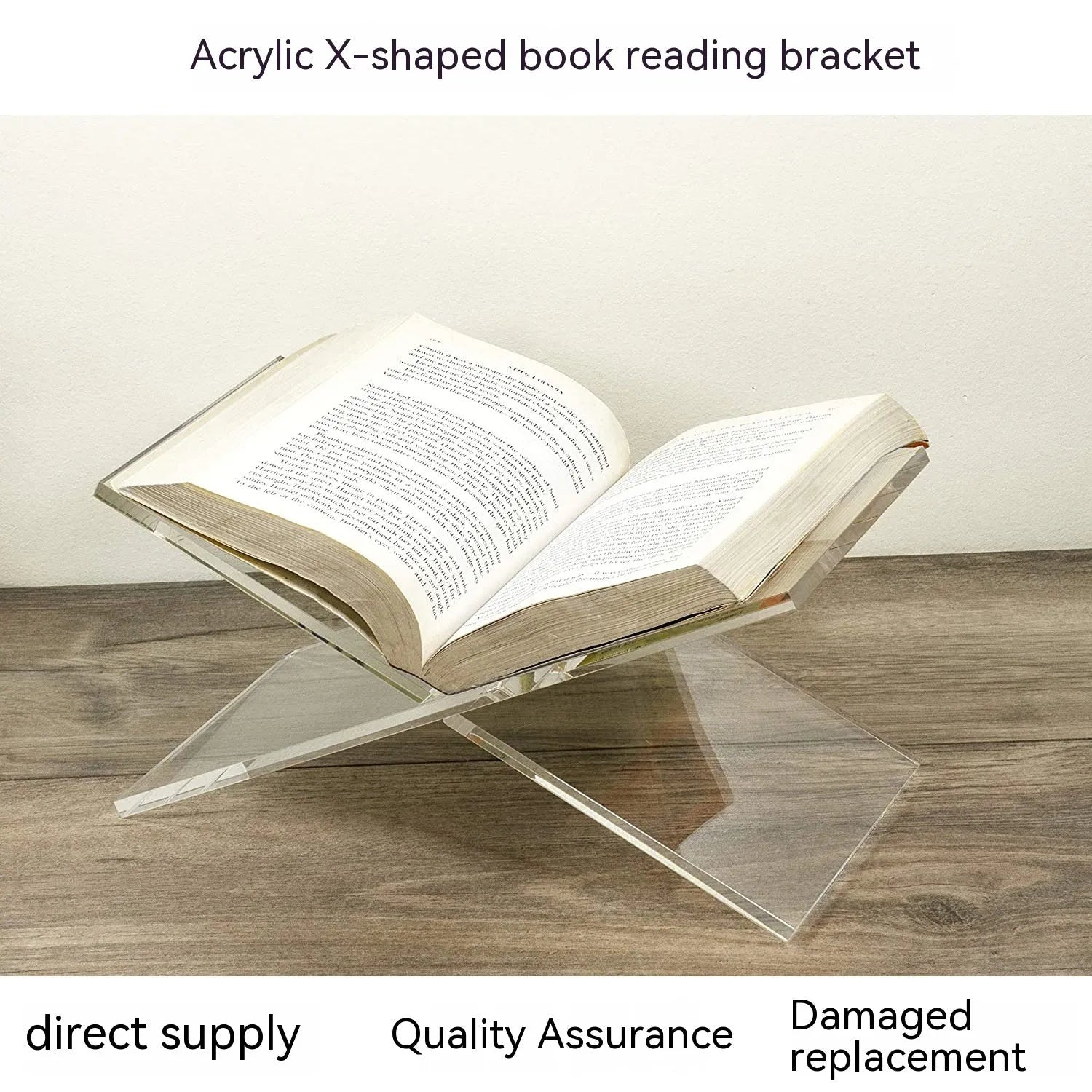 Clear acrylic X-shaped book display rack holding a book on a desktop