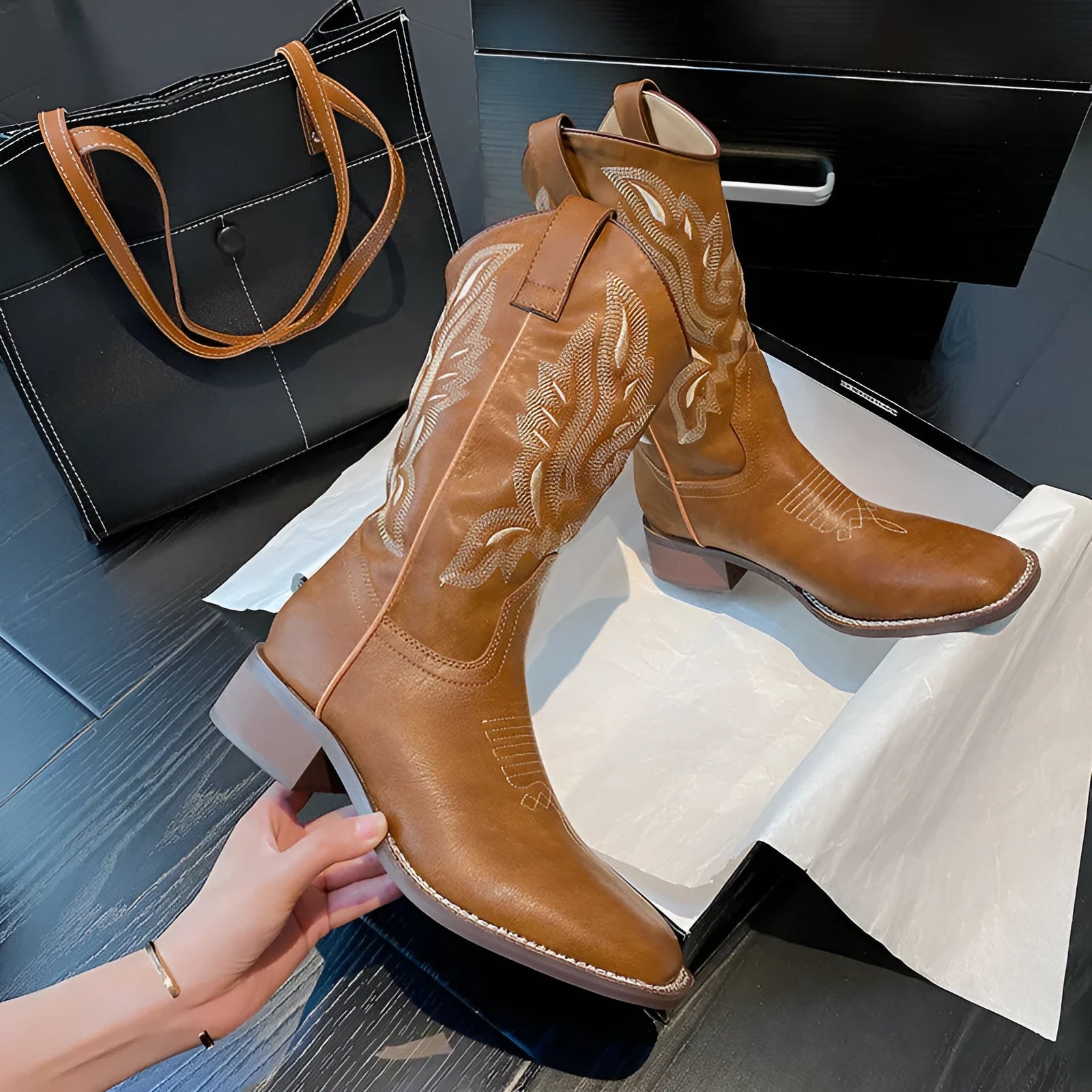 Brown women's embroidered mid-calf Martin boots with a square heel and leather lining.