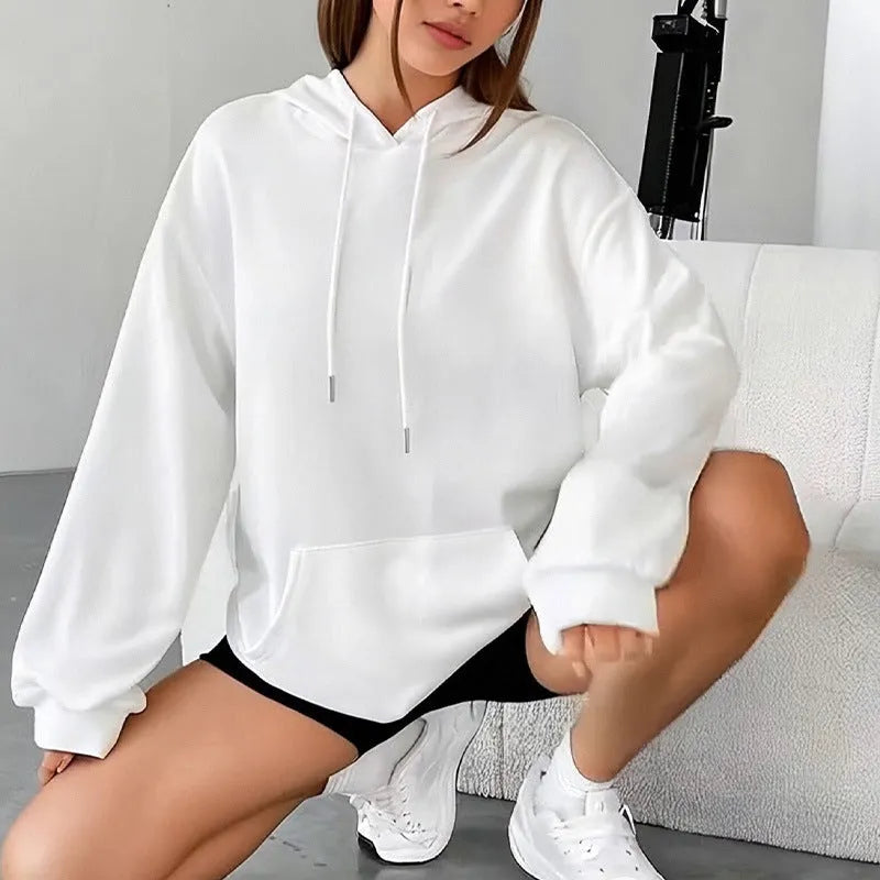 Women's loose fit grey hooded sweatshirt with drawstring and front pocket, long sleeves.