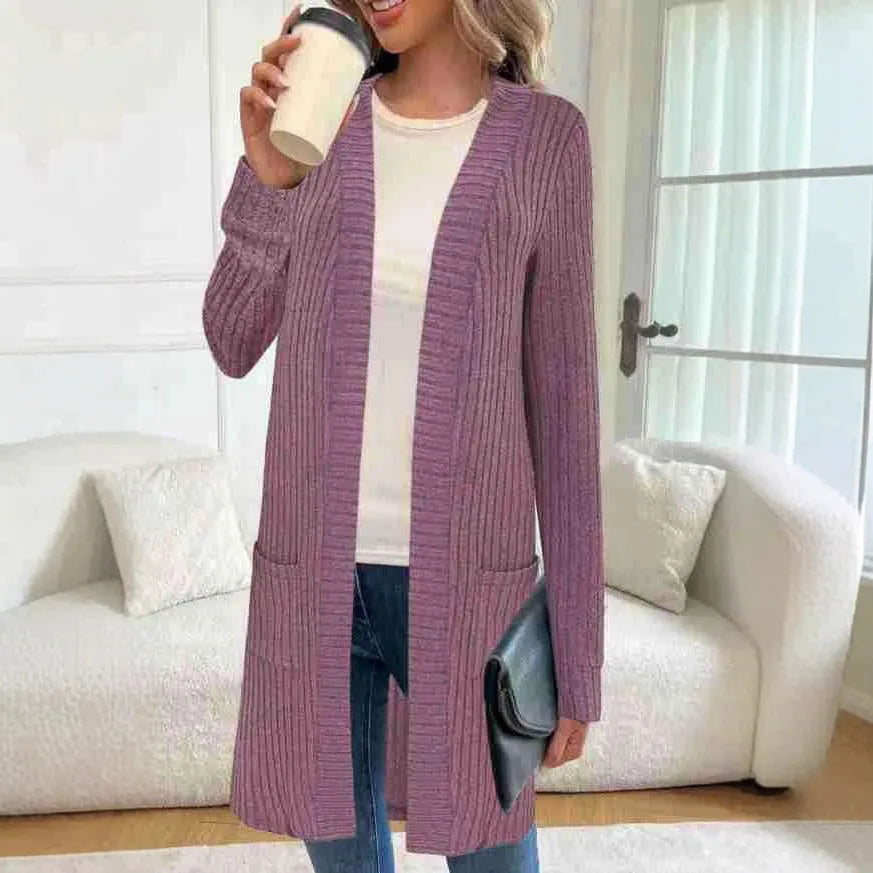 Long sleeve loose fit knitted cardigan jacket with pockets in polyester fabric.