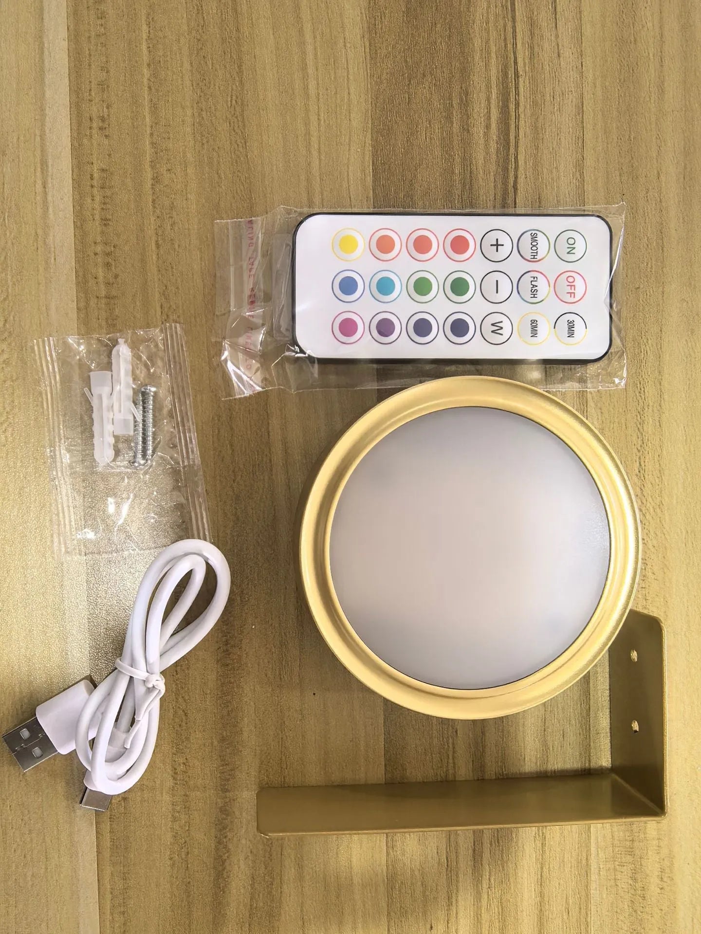 Magnetic wireless LED picture light with remote control in black finish illuminating a painting