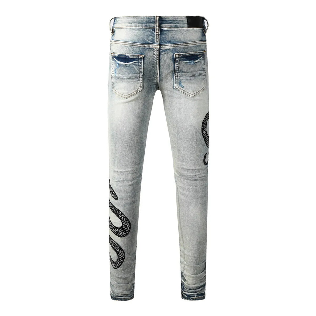 Blue distressed skinny jeans with button fly closure and micro elastic cotton fabric