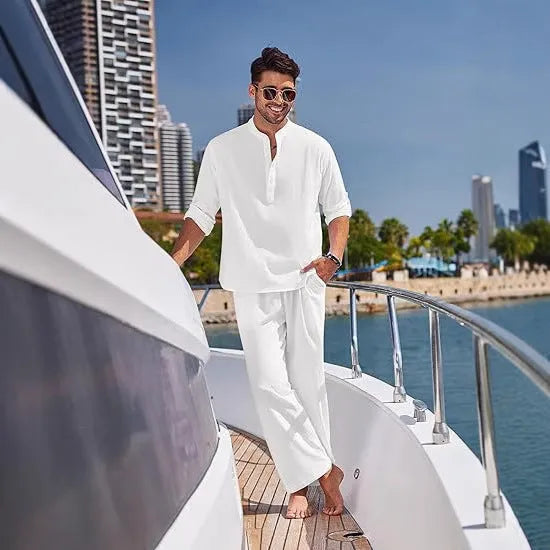 Man wearing a solid colour cotton long sleeve top and matching trousers from a casual suit.