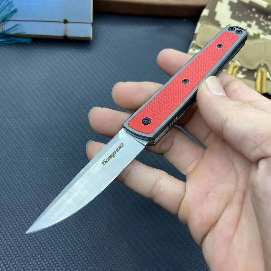 Folding fruit knife with stainless steel blade shown unfolded displaying 7cm blade length and 10cm handle