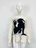 Women's loose grey alpaca wool sweater with tassel detailing and abstract pattern