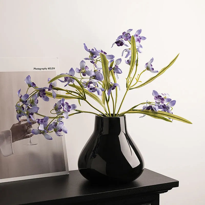 Ceramic round belly French decorative vase with artificial orchid flowers in black or white colour options