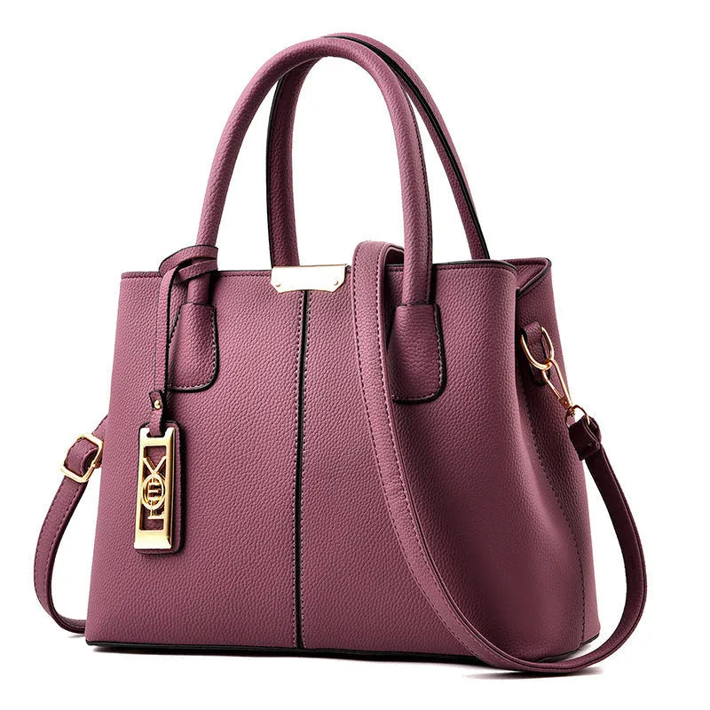 Soft large capacity PU leather shoulder bag in a horizontal square shape with a leather strap.