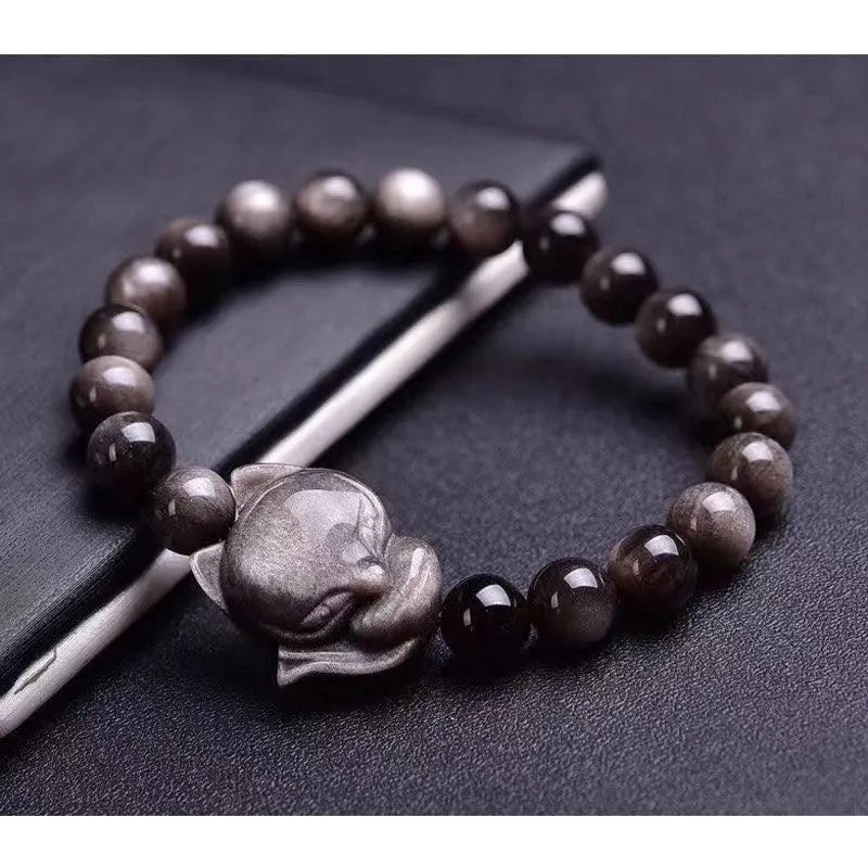 Obsidian fox charm bracelet with 8mm bead and adjustable sliding clasp.