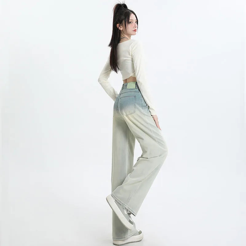 Women's gradient blue straight-leg denim trousers with wide-leg cut on hanger
