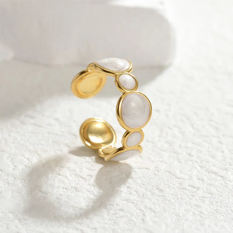 Simple stainless steel geometric ring for women with an adjustable opening.
