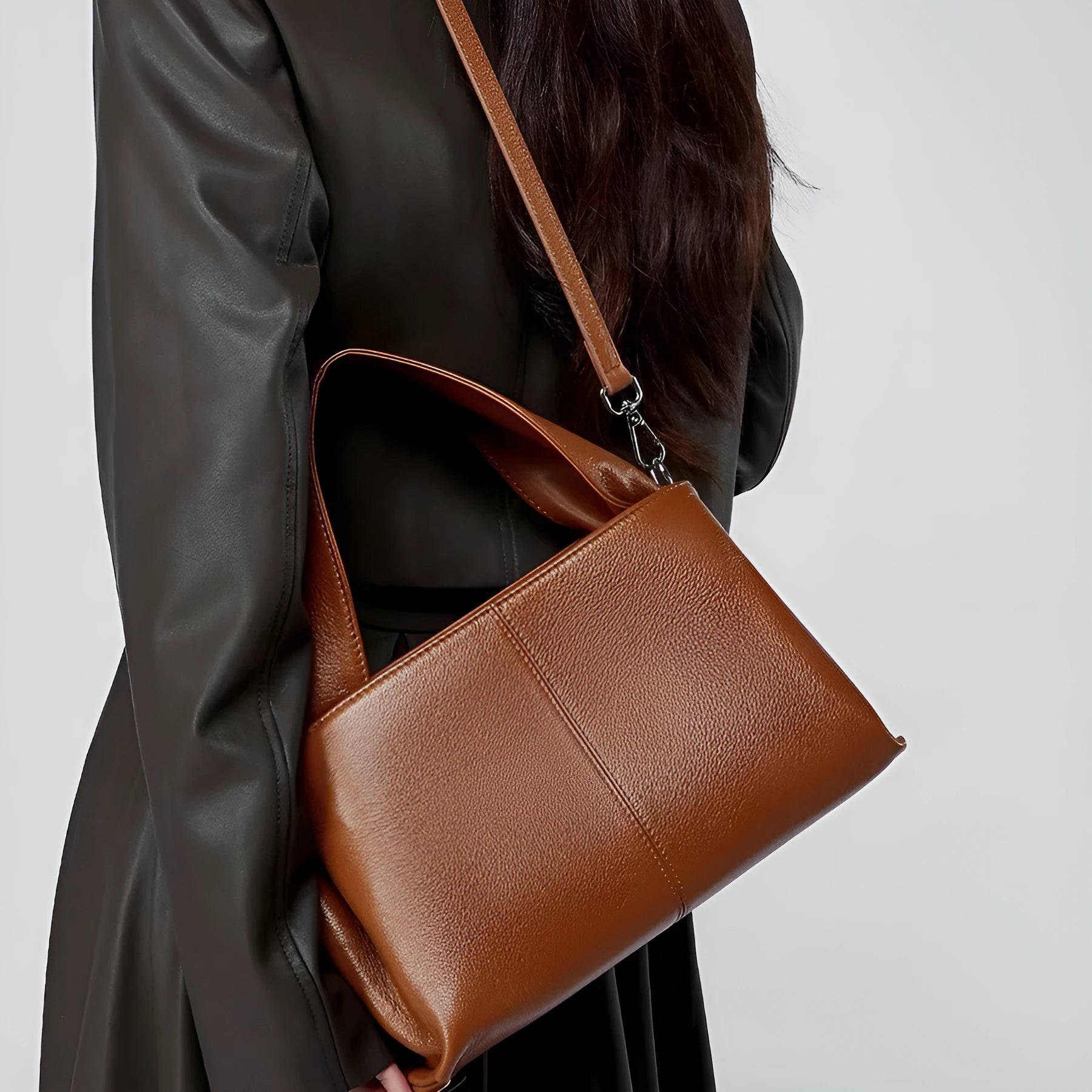 Genuine cowhide messenger bag in horizontal square shape with double shoulder straps and retro texture
