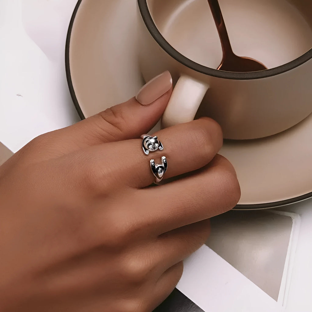Adjustable sterling silver panda ring with white gold plating and open bracelet design.