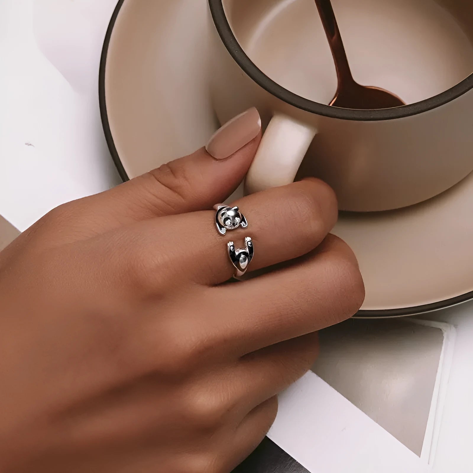 Adjustable sterling silver panda ring with white gold plating and open bracelet design.
