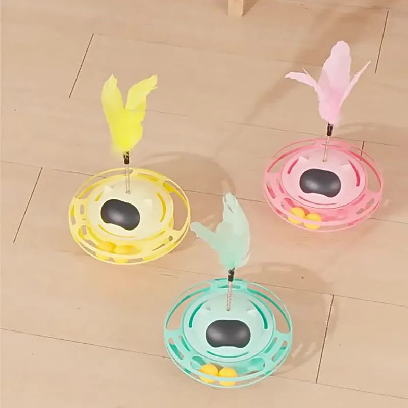 Pink plastic cat tumbler turntable toy with colourful balls measuring 17x10cm