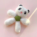 Brown bear shaped stuffed catnip ball edible chewing toy for cats on a white background.