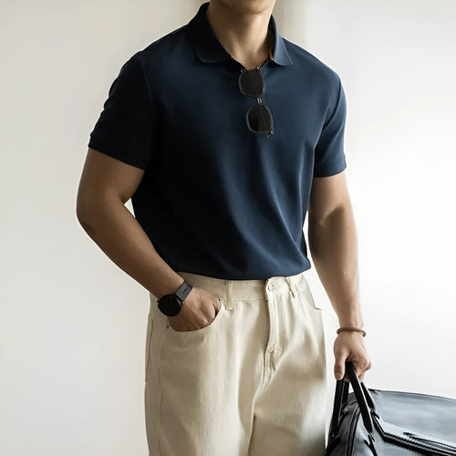 Man's short-sleeve blue polo shirt on a hanger, showing the classic collar and button placket.