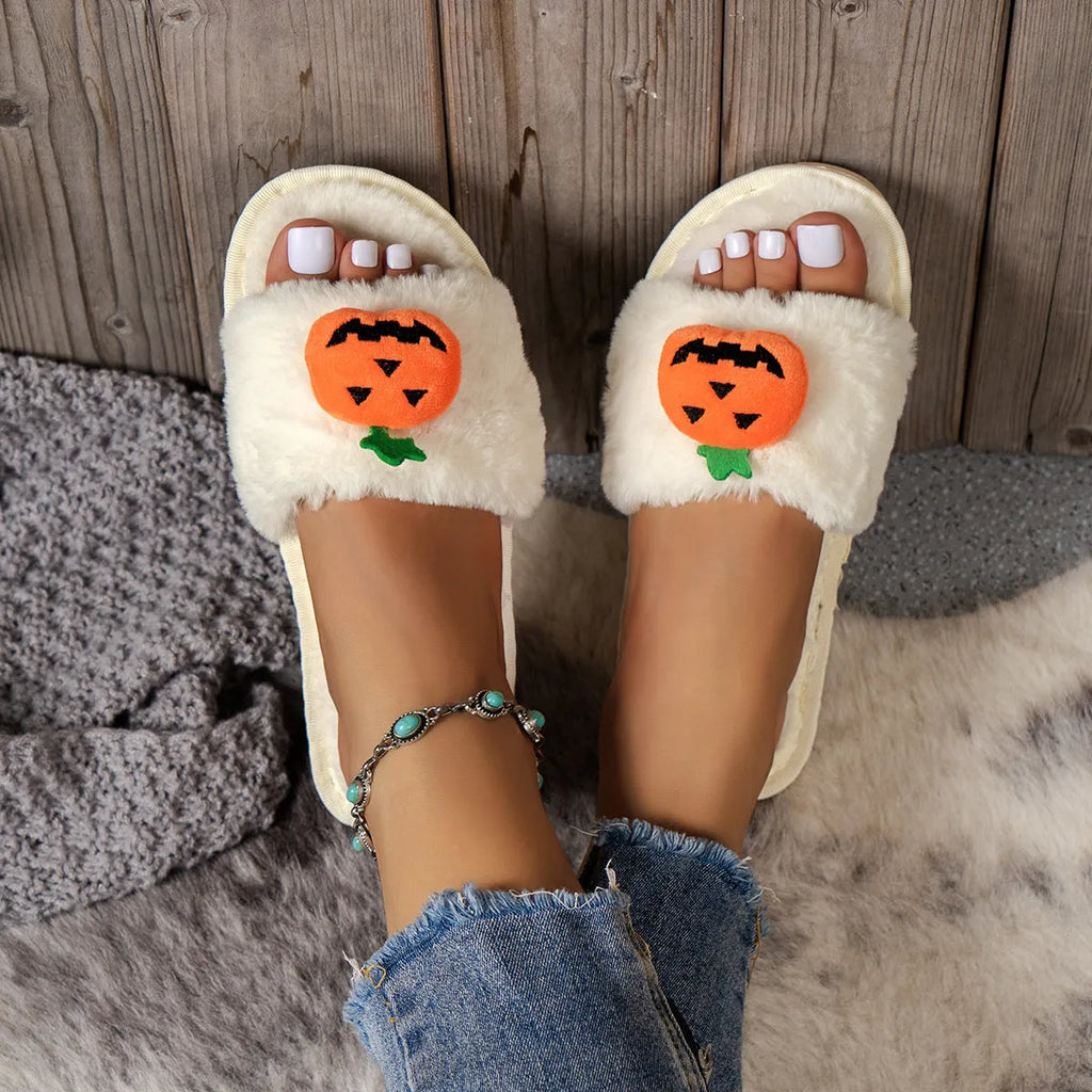Halloween pumpkin plush slippers with synthetic fur uppers and PVC soles in white and yellow