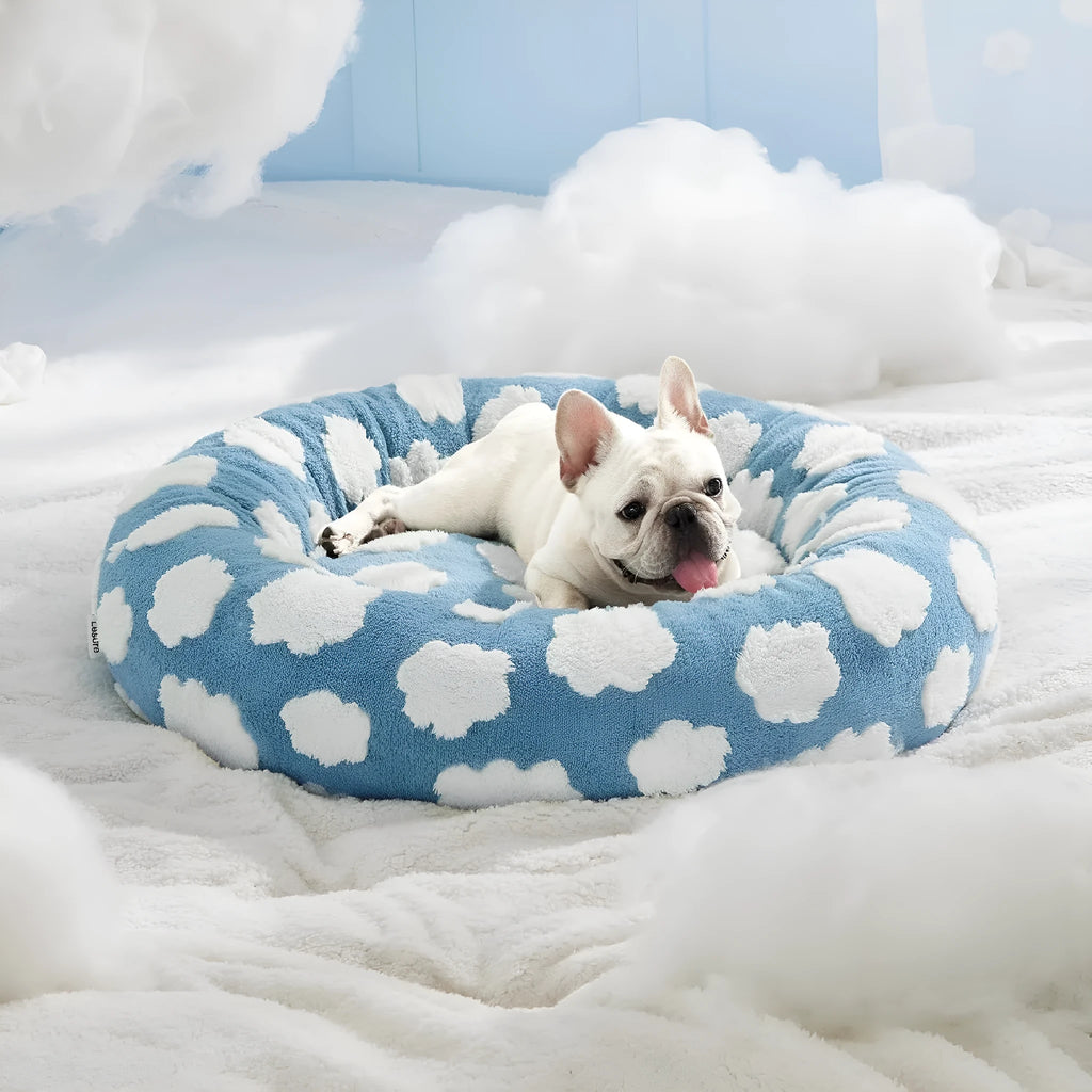 Round plaid dog bed on a plastic base, shown in sea blue and white check pattern.