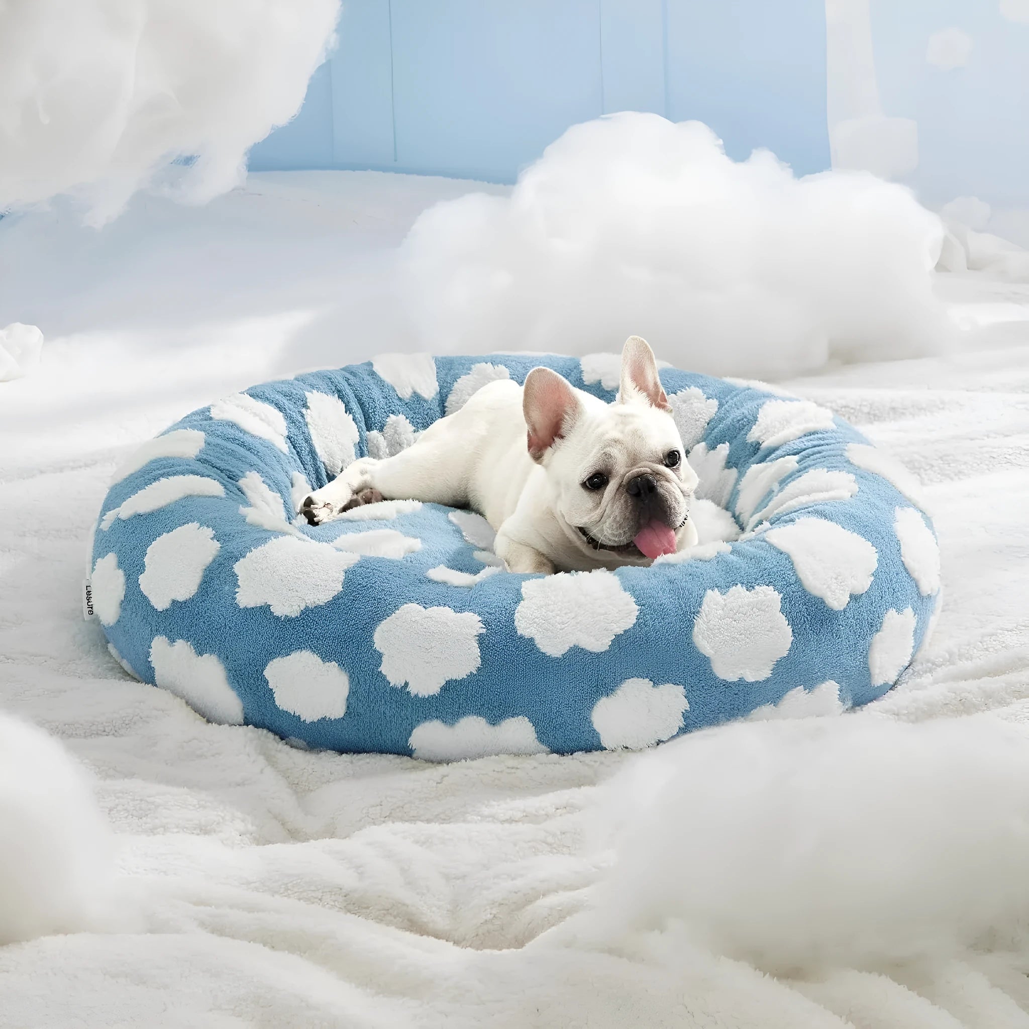 Round plaid dog bed on a plastic base, shown in sea blue and white check pattern.