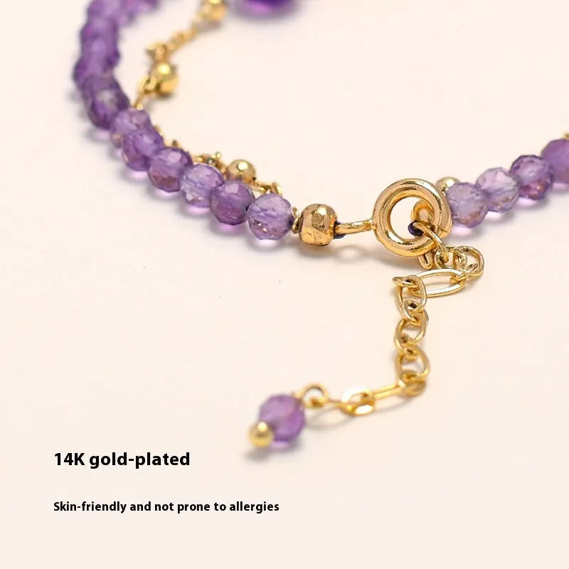 Chinese style women's crystal bracelet with amethyst coloured simulated diamond stones