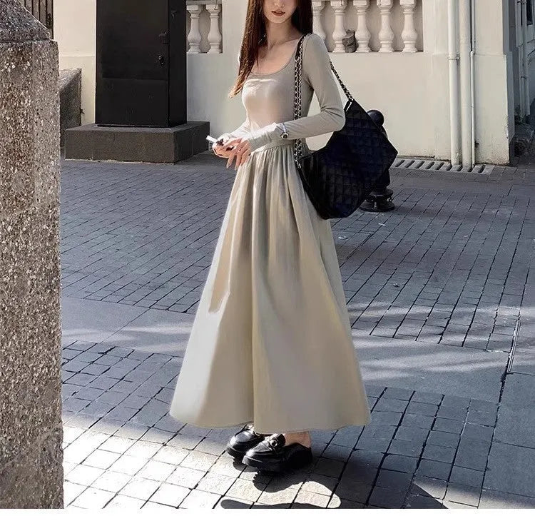 Women's black square collar knitted dress with long sleeves and an A-line skirt.