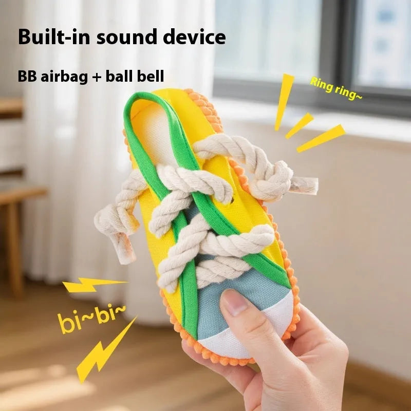 Plastic dog chew toy with sound squeaker in bendable slipper design for dental care