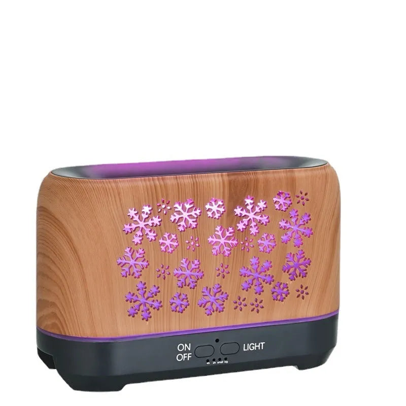 Square snowflake pattern humidifier with colourful flame effect and remote control on desktop