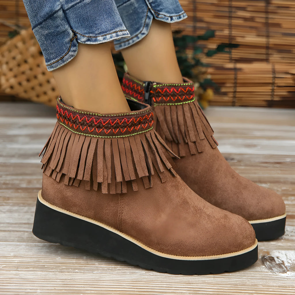 Women's black suede wedge ankle boots with a thick platform sole and side zipper.