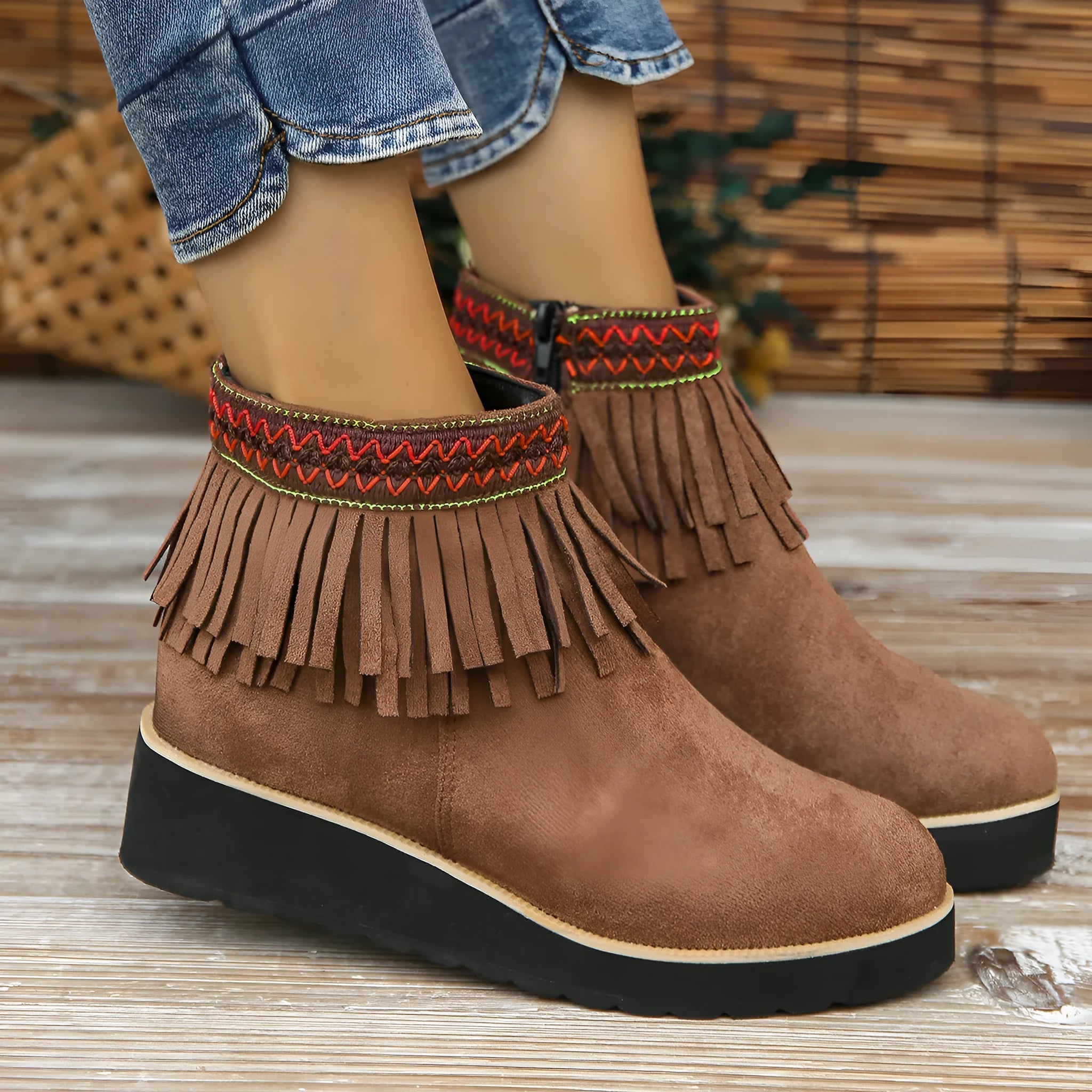 Women's black suede wedge ankle boots with a thick platform sole and side zipper.
