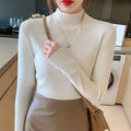 Women's slim fit long sleeve knitted top in viscose fibre shown in apricot colour.