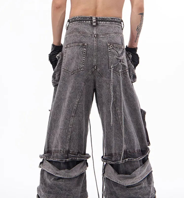 Grey distressed denim overalls with rope stitching and mop pant design on male model