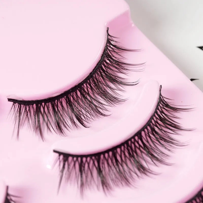 Pack of 15 pairs of natural wispy manga false eyelashes on black plastic bands for cosplay.