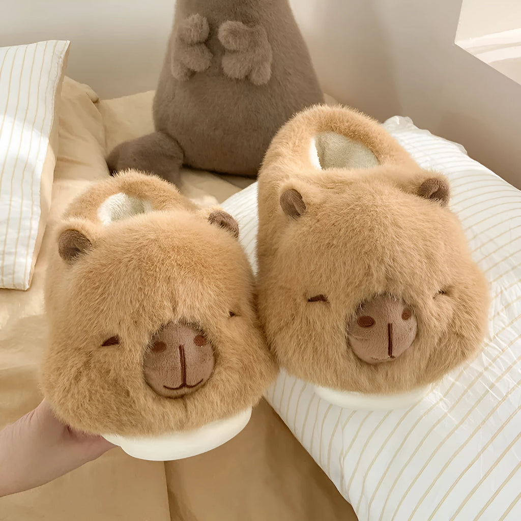 Light brown women's winter slipper boots with a cartoon pattern, cotton canvas upper, and artificial wool lining.