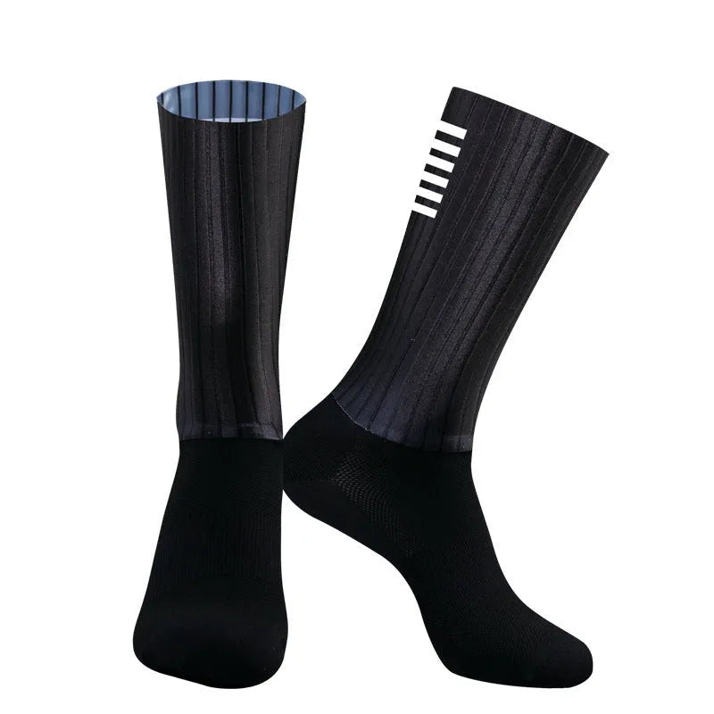 Athletic sports socks for cycling and running in six colour options including orange, black, and purple.