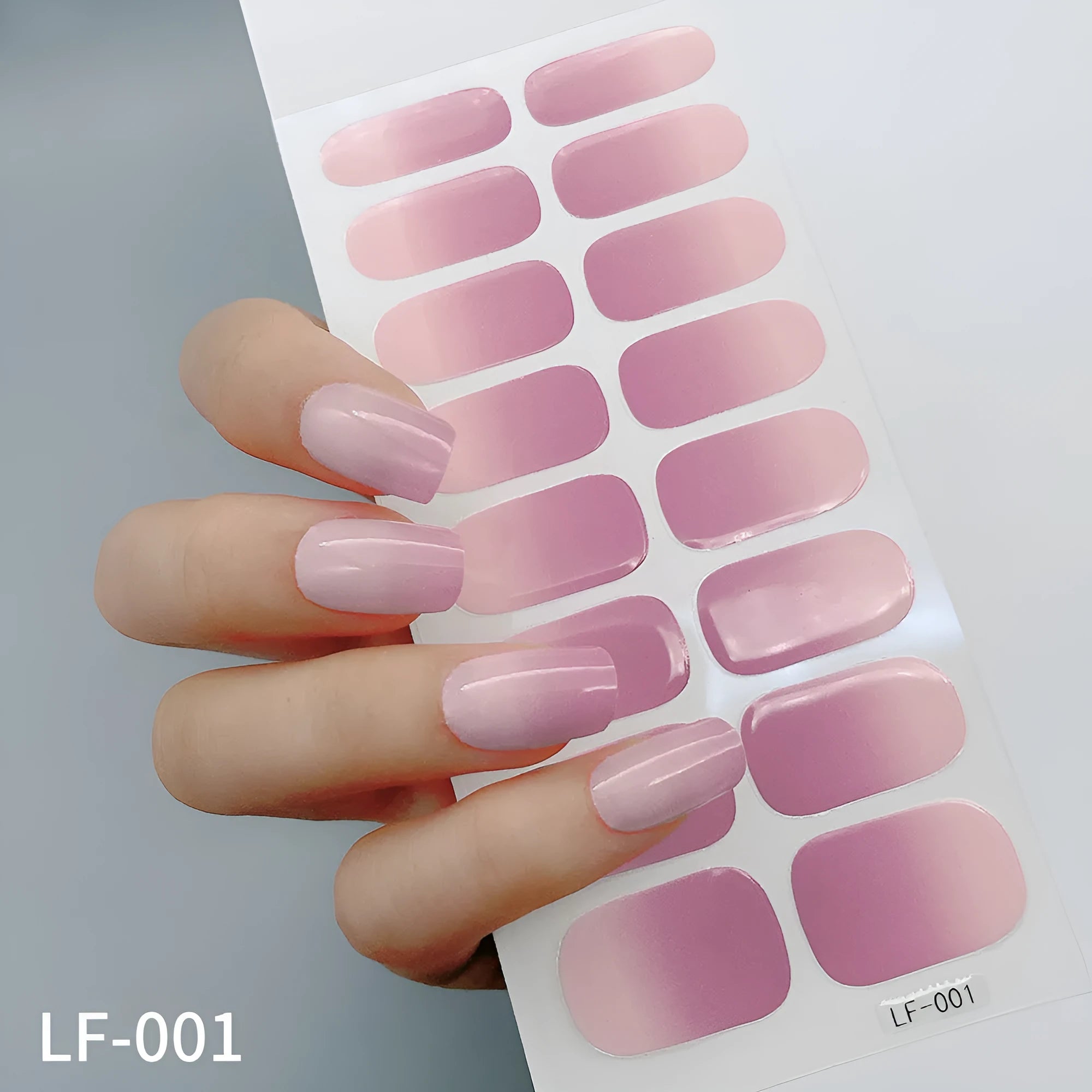 Full coverage nail art stickers sheet with 16 designs including cross, rose, tulip, and cartoon patterns.
