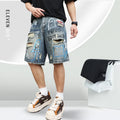 Blue mens denim shorts with ripped knees and graffiti design, straight leg fit.