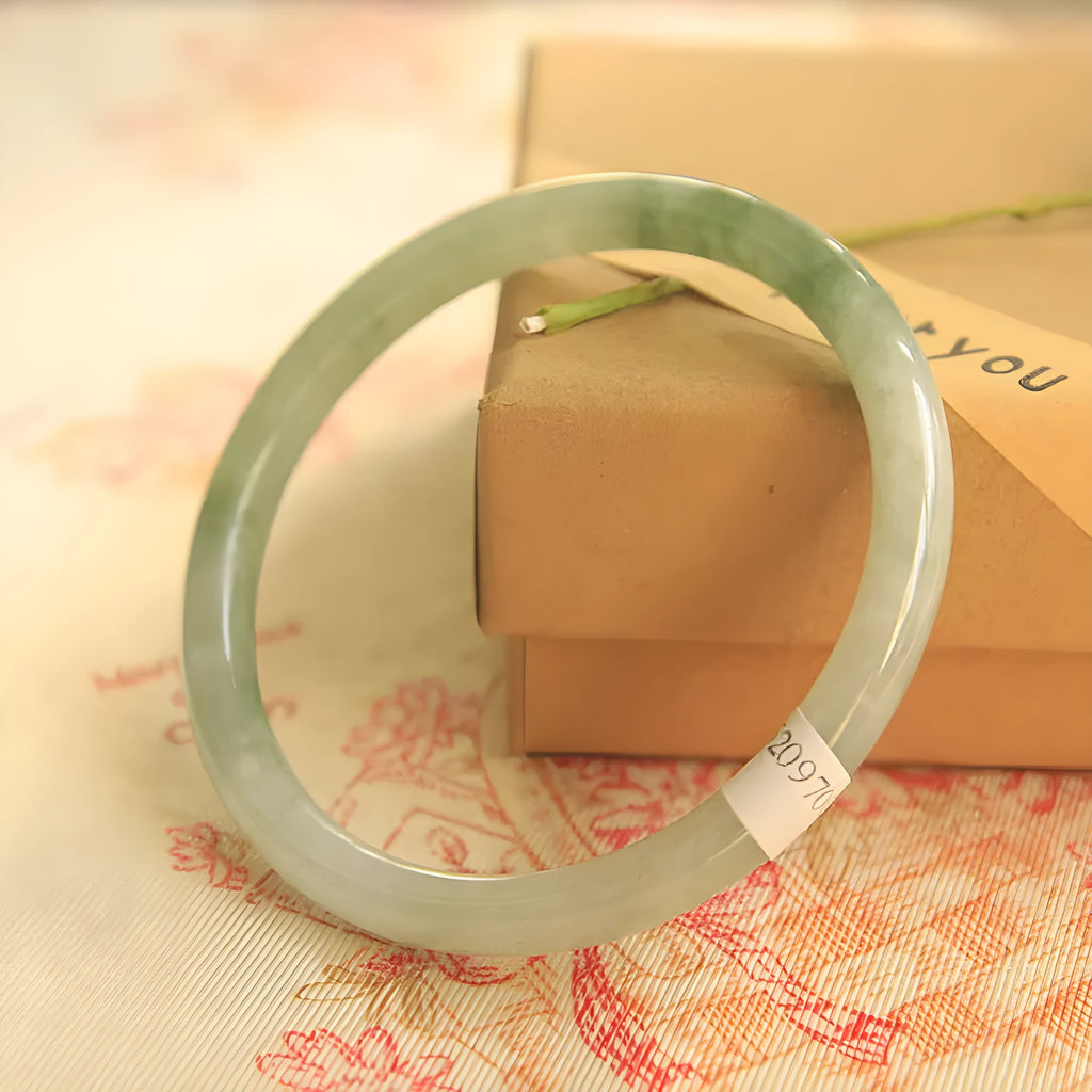 Green waxy jade geometric bracelet with Chinese-style design showing size measurement options