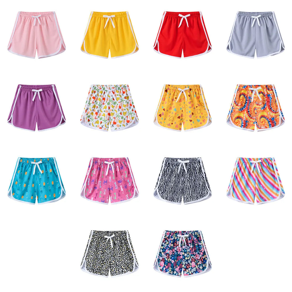 Children's polyester beach shorts in multiple prints and solid colours with size range 100-140cm