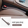 Black polyurethane car seat gap filler strip preventing items falling between vehicle seats