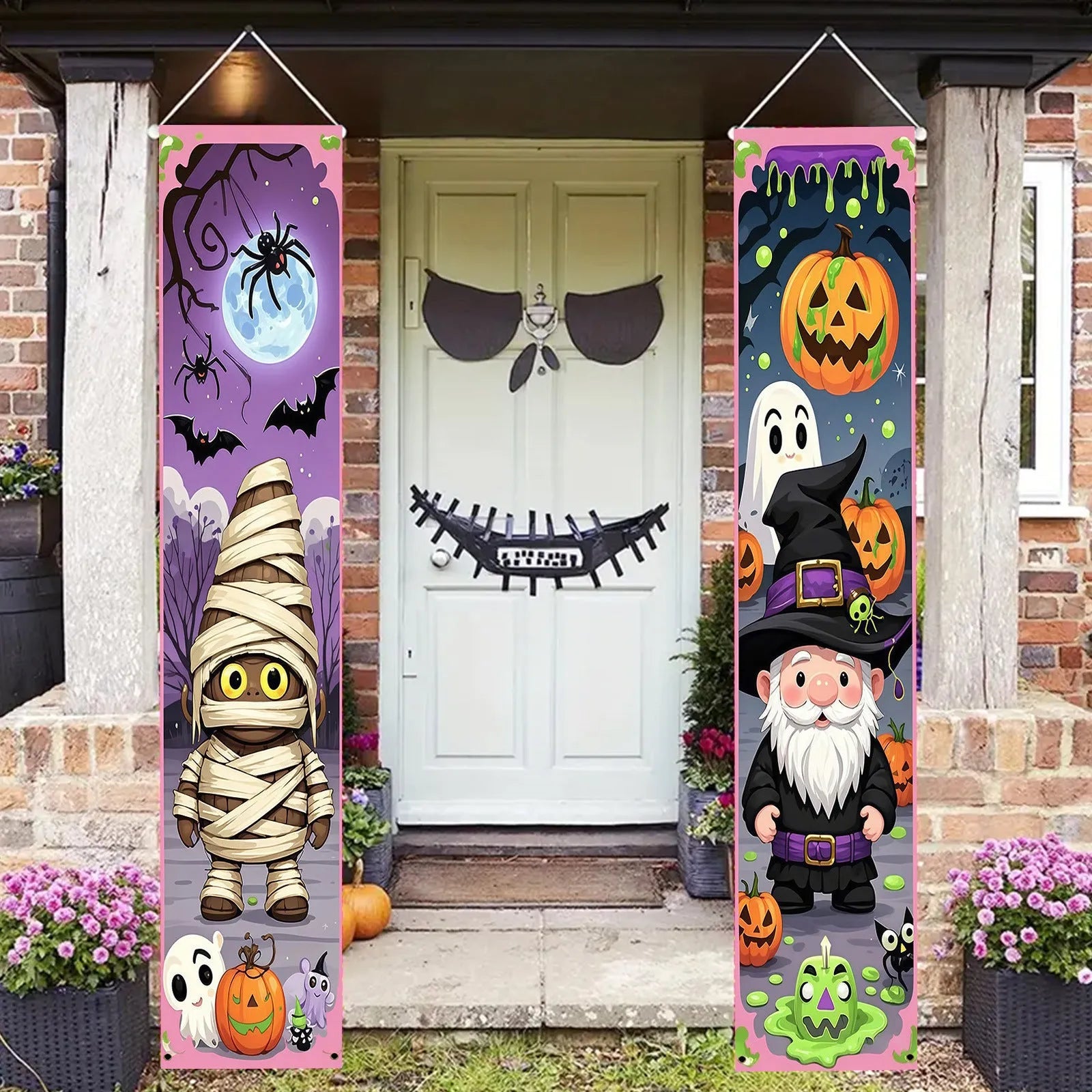 A pair of long Halloween-themed polyester banner decorations hanging on a wall.