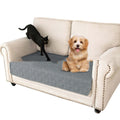 Double-sided waterproof dog sofa cushion in dark grey and light grey reversible colours on a sofa