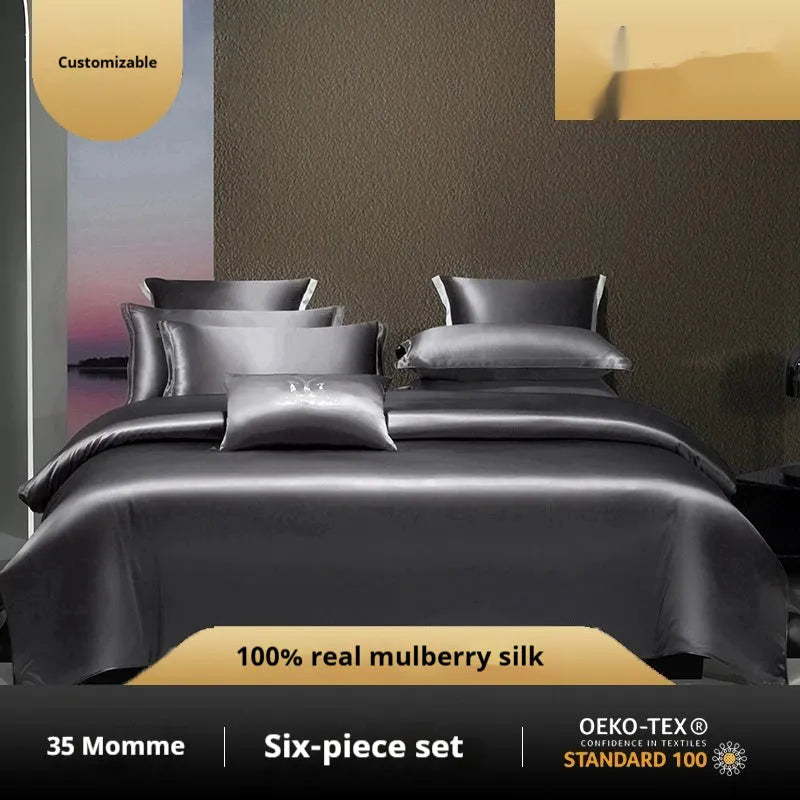 Solid colour silk four-piece quilt cover set shown in a light luxury bedroom setting.