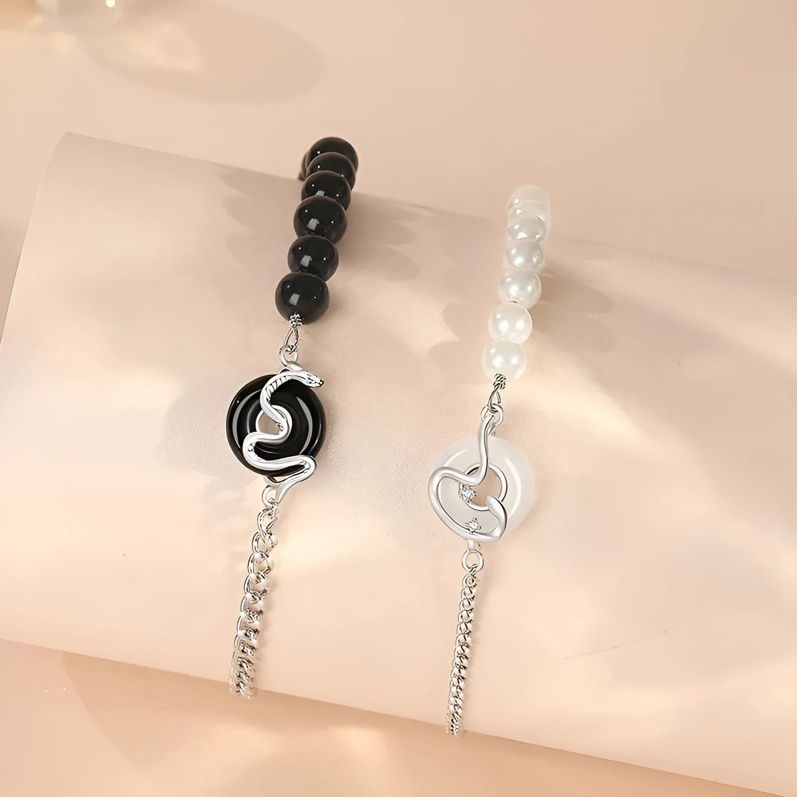 925 sterling silver couple bracelet with snake charm, obsidian pearl, and safe buckle in new Chinese style.