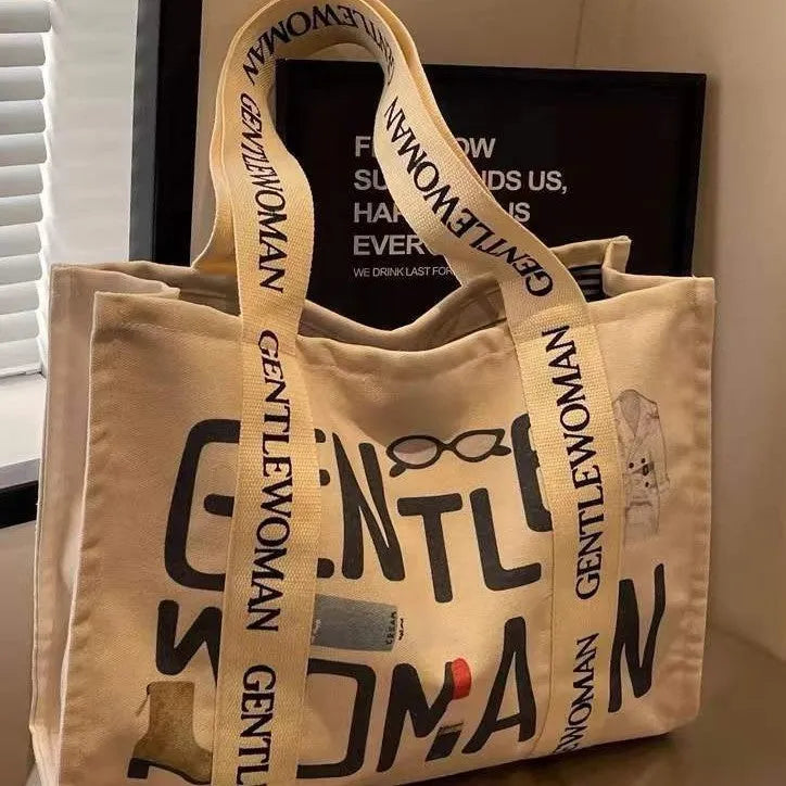 Large canvas tote bag with printing detail in black letters, coloured letters, or pattern style variations